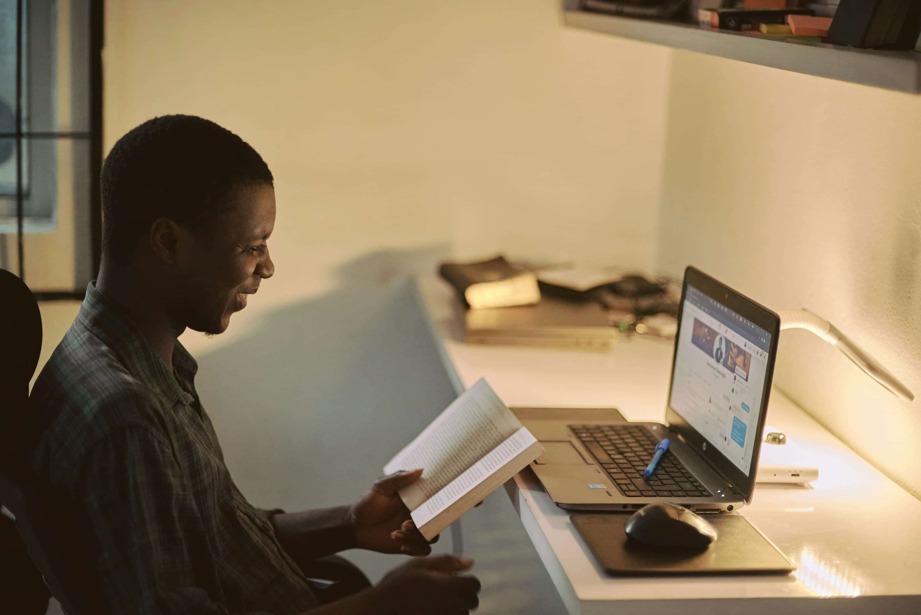 A student reading and studying online on a laptop